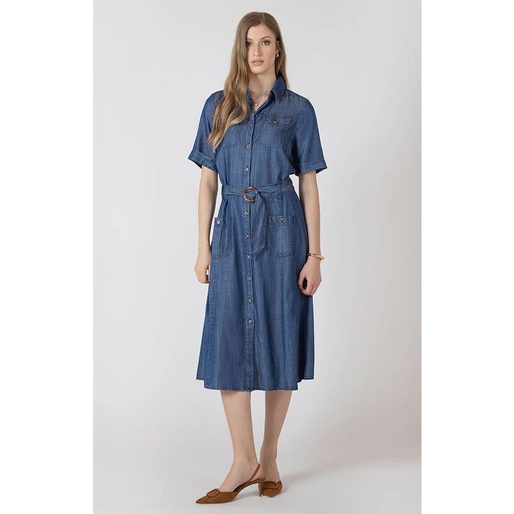 Woman wearing a blue denim dress on a white background