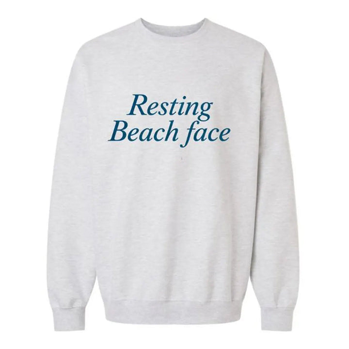 White sweatshirt with 'Resting Beach Face' text on a white background